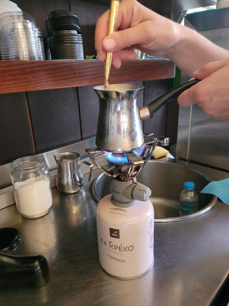 boiling Greek coffee and preparing it to drink