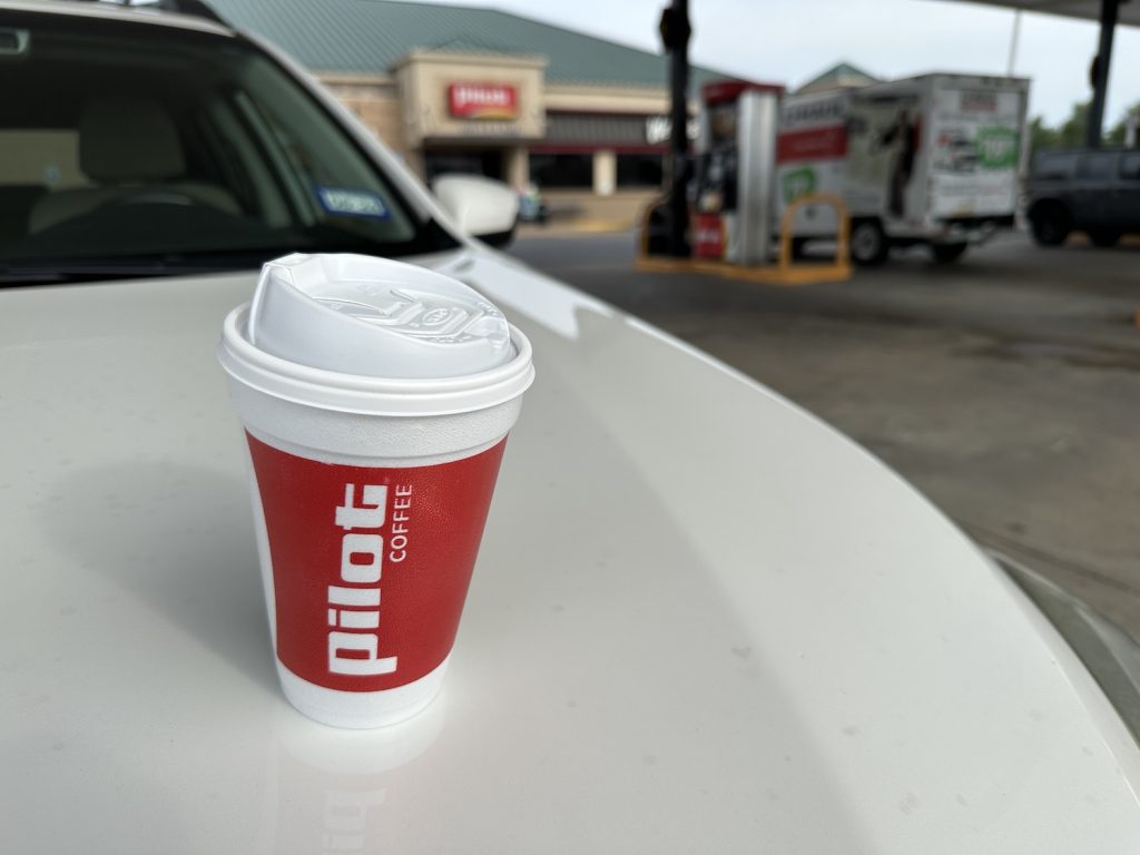 cup of pilot gas station coffee outside of travel center