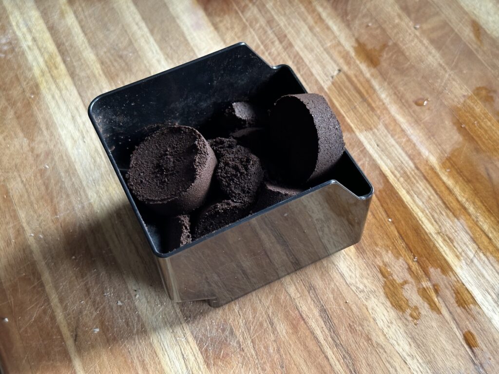 espresso pucks in a container