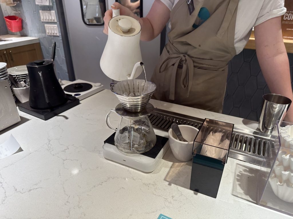Making a flash brew coffee Japanese style pour over onto ice cubes