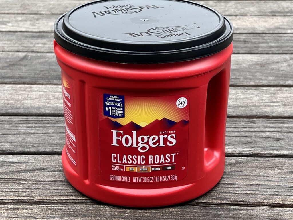 Red canister of Folgers Classic Roast coffee