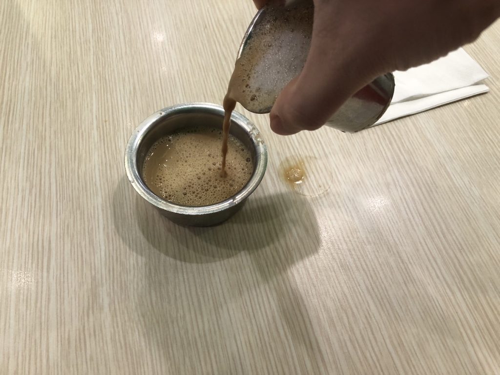 pouring South Indian filter coffee