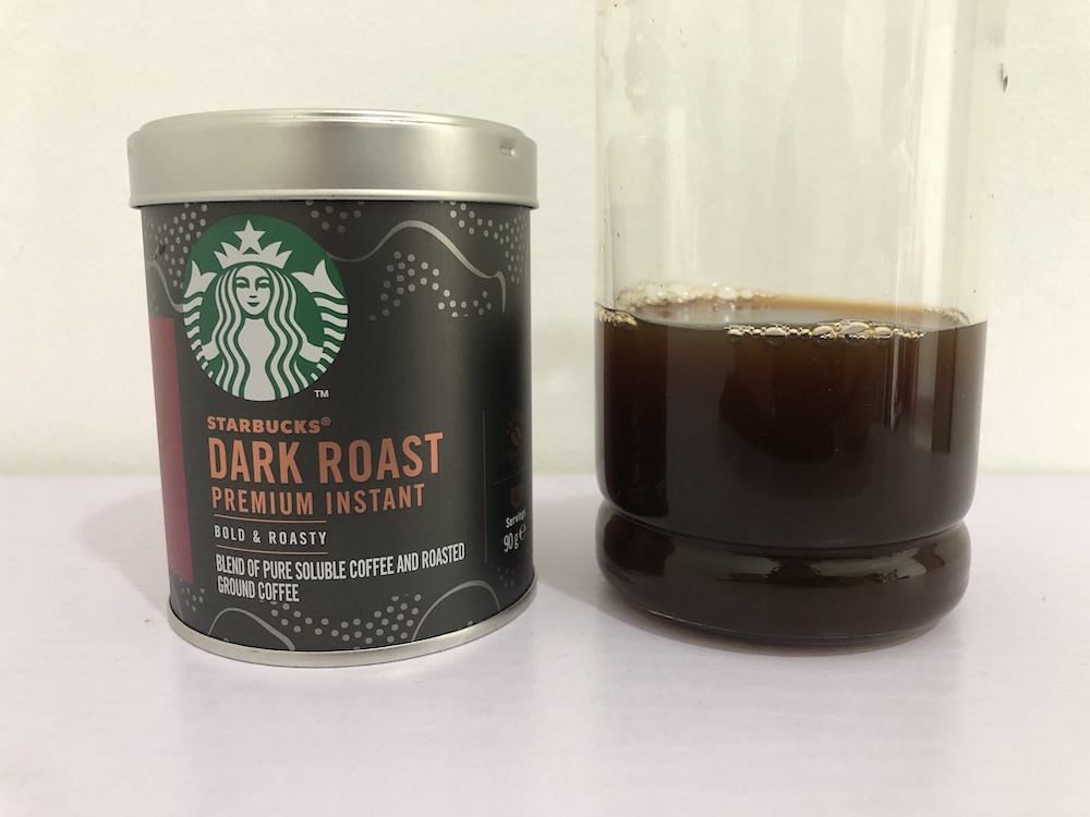 Can of Starbucks Premium Instant coffee with a glass of the coffee to see what it looks like